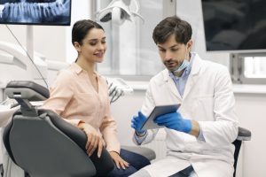 how do you choose between dentures and dental implants