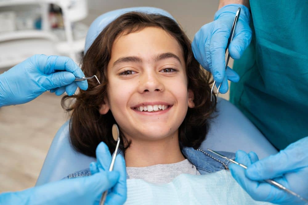 a girl is smiling after dental treatment